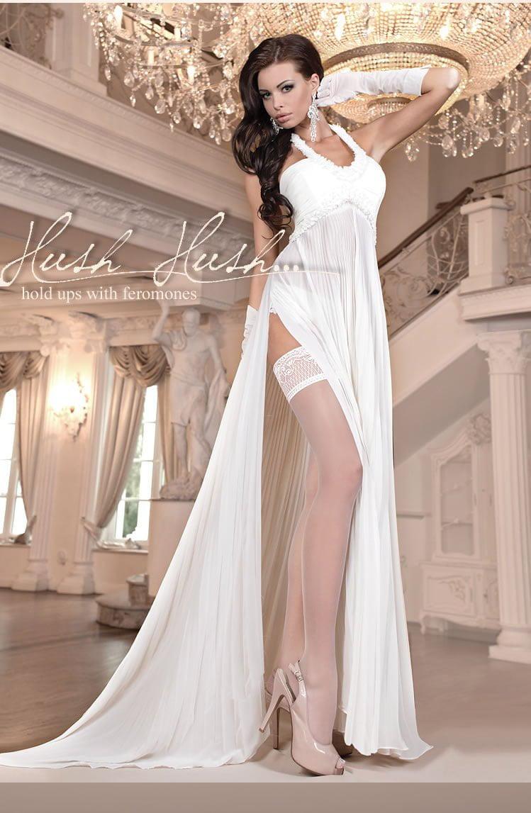 A woman in elegant white lingerie poses on a staircase in a luxurious setting, featuring draped fabric and ornate chandeliers. She wears a long, flowing gown, ivory thigh-high Ballerina 800 Hold Up With Pheromones by Ballerina, and beige heels with long gloves completing her sophisticated look. Text reads "Ballerina 800 Hold Up With Pheromones Avorio (Ivory).