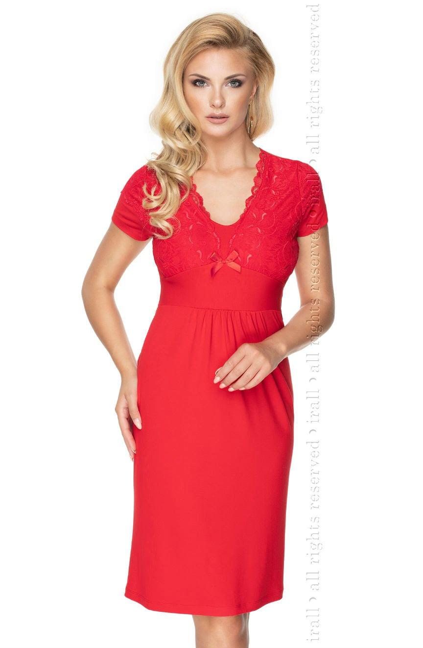 A person with long blonde hair is standing and looking at the camera, wearing the elegant Irall Gia Red Nightdress by Irall, featuring a knee-length design with elastic lace detailing on the neckline and short sleeves. The nightdress also has a small bow at the center of the chest.