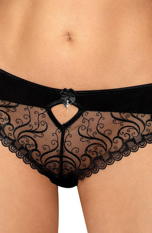 A close-up of a person's midsection wearing the Roza Anuk Brief Black panties. These stylish briefs from Roza feature intricate floral lace patterns, delicate embroidery, a small keyhole cutout in the front adorned with a bow and a small charm. The comfortable and fashionable Roza Anuk briefs beautifully highlight the person's stomach and part of their upper thighs.