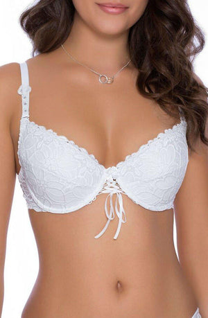 A woman is wearing the Roza Damaris White Bra from the Roza brand, adorned with a bow tie embellishment at the front. This elegant push-up bra, part of an exquisite lingerie collection, features adjustable straps. She is also wearing a delicate silver necklace with a circular pendant. Her dark, wavy hair cascades over her shoulders.
