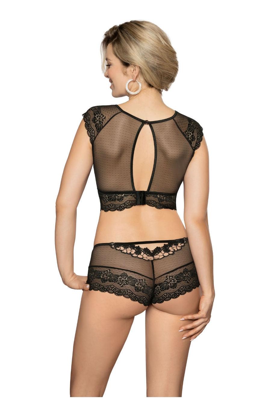 A woman with short blonde hair and large hoop earrings is shown from the back, modeling the Roza Ellba Black Boxer lingerie set. The top features short sleeves and a central keyhole opening, making it an ideal gift. The high-waisted bottoms are adorned with intricate lace detailing, all crafted by the brand Roza.