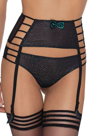 A close-up of a person wearing the black Roza Ilaris Suspender Belt, adorned with a high-waisted design and multiple straps. The front of the belt features a small green bow, complemented by matching panties and thigh-high stockings connected with adjustable suspender clips.