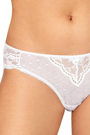 Close-up of a person wearing Roza Lagerta Brief White by Roza, featuring white lace panties with a delicate polka dot pattern and small bow detail at the front. The sheer mesh fabric showcases intricate floral lace designs on both sides, providing a feminine and elegant look.