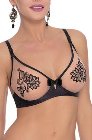 A woman is wearing the Roza Mehendi Soft Cup Bra Black by Roza, featuring beige and black floral lace detailing. She has drop earrings, and her lips are painted a muted pink shade. Henna art adorns her hands, adding an elegant touch to the ensemble.