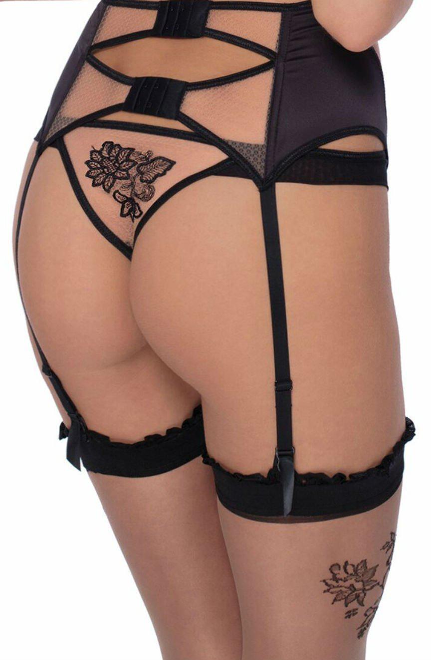 A person wearing Roza lingerie, including a garter belt, sheer Roza Mehendi Stockings Black with floral designs, and matching panties with similar floral embroidery on the backside. The image focuses on the back view, highlighting the intricate details of the lingerie.