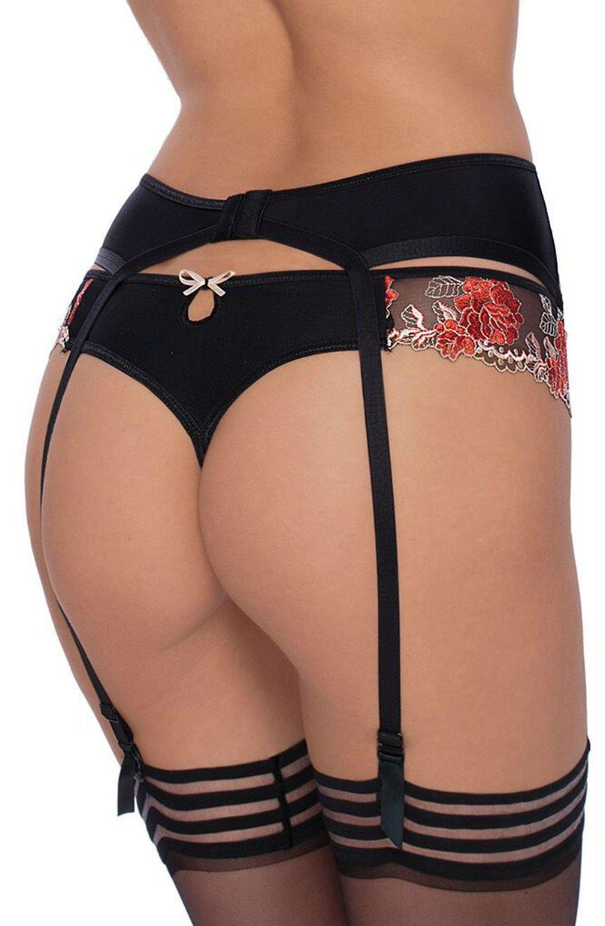 A person is wearing the Roza Natali Black Suspender Belt by Roza, featuring exquisite black lingerie adorned with red and pink floral embroidery. The ensemble includes a garter belt and thigh-high stockings secured by black garters. The back view showcases the intricate details of the design beautifully.