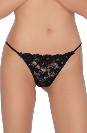 A person is wearing a pair of Roza Sarina Black panties by Roza. The image focuses on their midsection, showcasing the exquisite floral lace design crafted from premium materials. The panties feature thin side straps and small bow accents at the front.