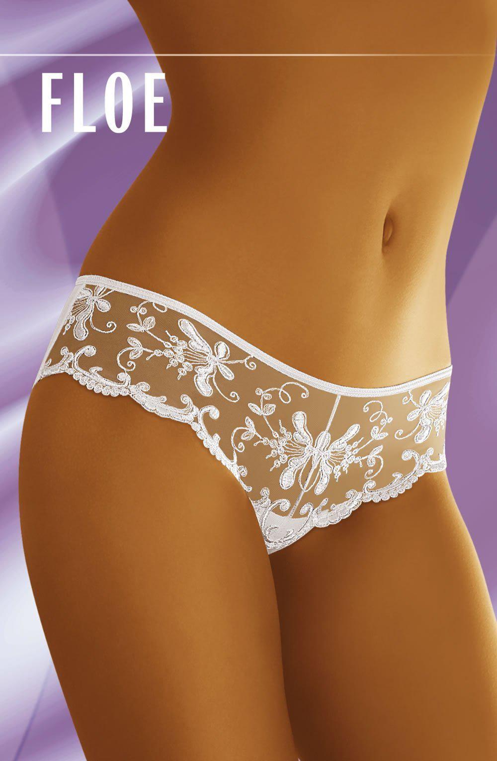 A person is shown wearing the Wolbar Floe Black Brief, featuring sheer, embroidered lace panties with a floral pattern on a lavender background. The brand name "Wolbar" is displayed at the top of the image. The person's torso is cropped to focus on the luxurious comfort of this lacy brief.